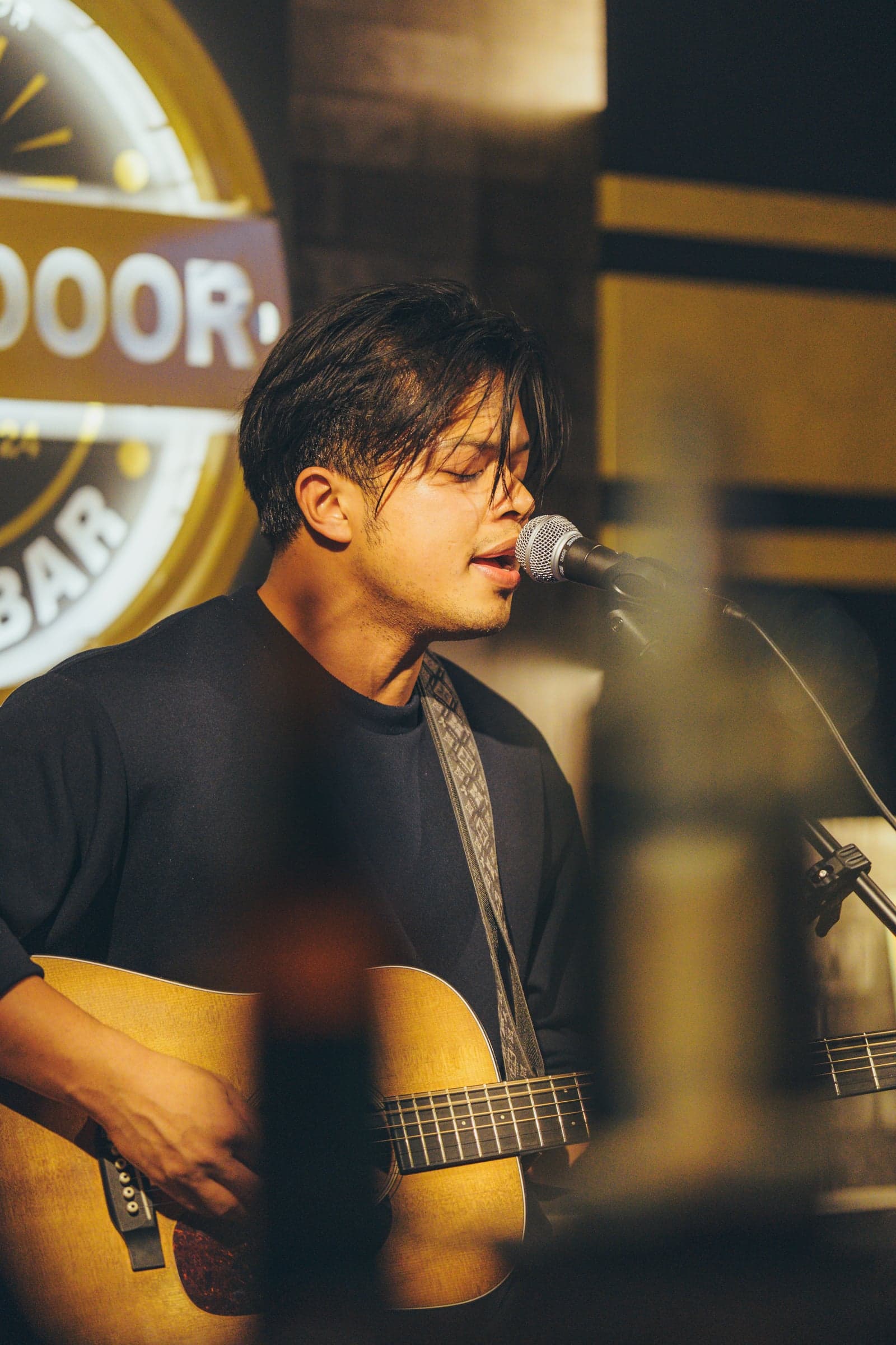 Jude singing on the Backdoor stage.